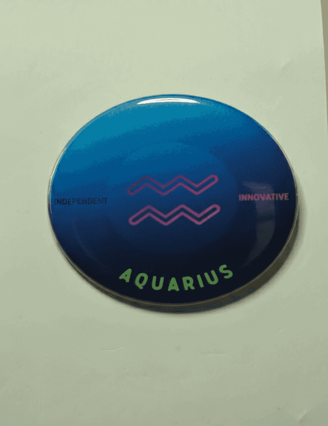 Aquarius zodiac badge with blue ombre background and pink wave symbols