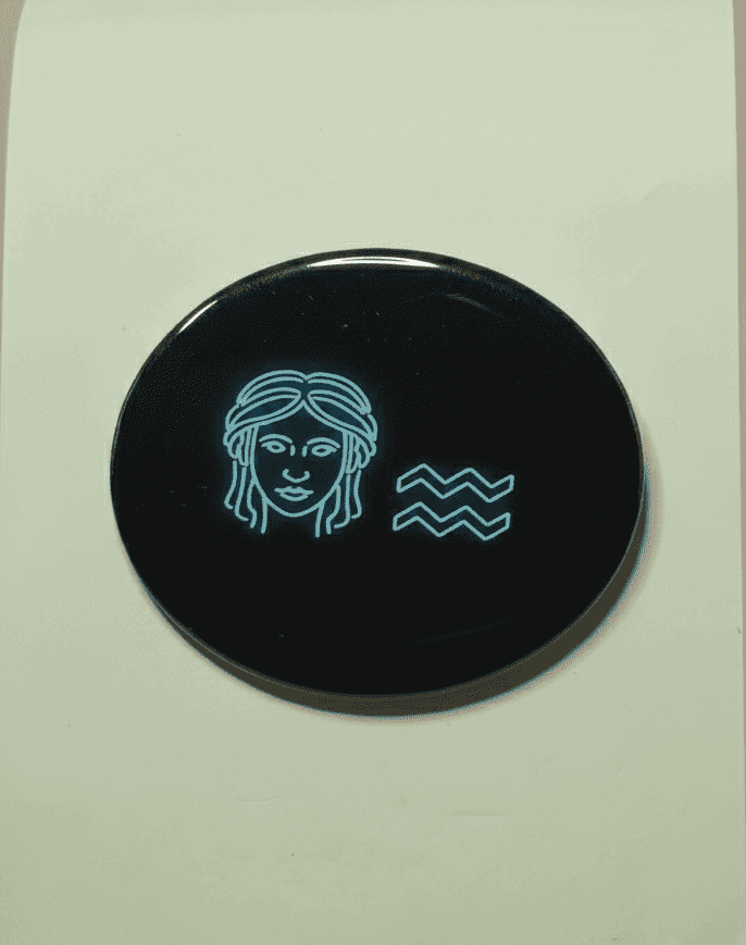 Neon Aquarius zodiac badge magnet with onyx black background and electric blue design