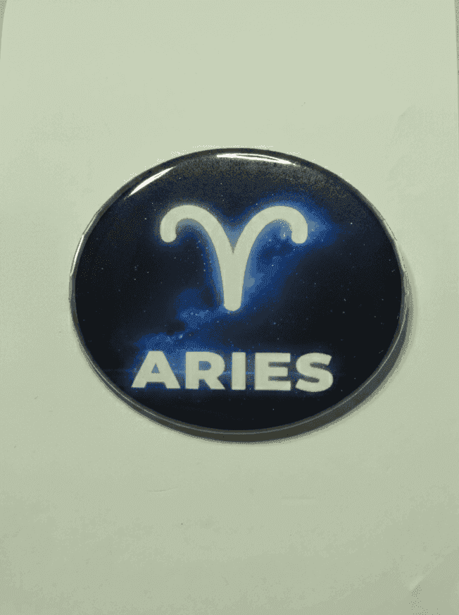 Aries zodiac badge with constellation symbol and starry background