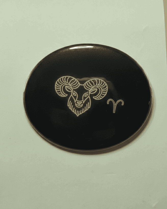 Black Aries zodiac magnet with ram's head and Aries symbol