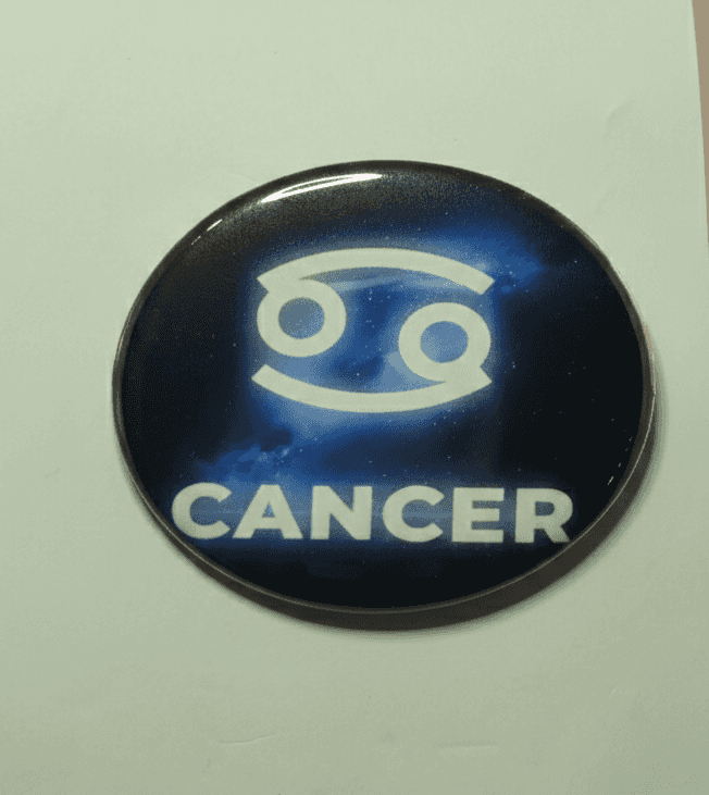 Cancer Galaxy zodiac badge with cosmic blue design