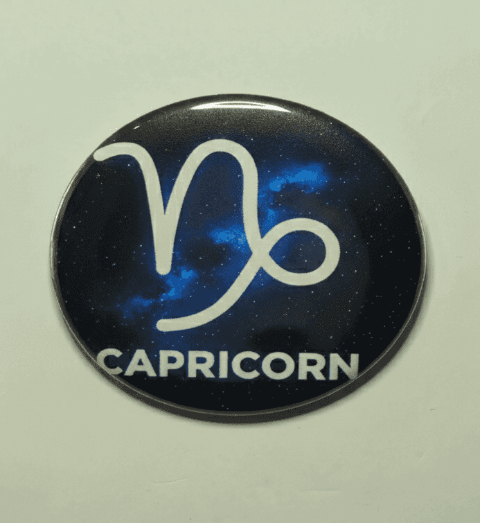 Capricorn zodiac badge with galaxy background