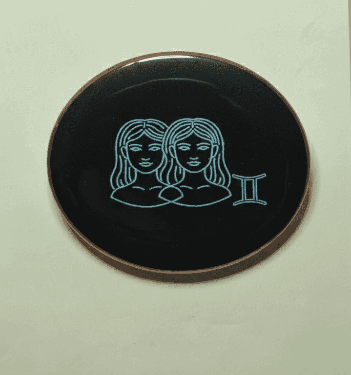 Gemini zodiac badge with twin women illustration