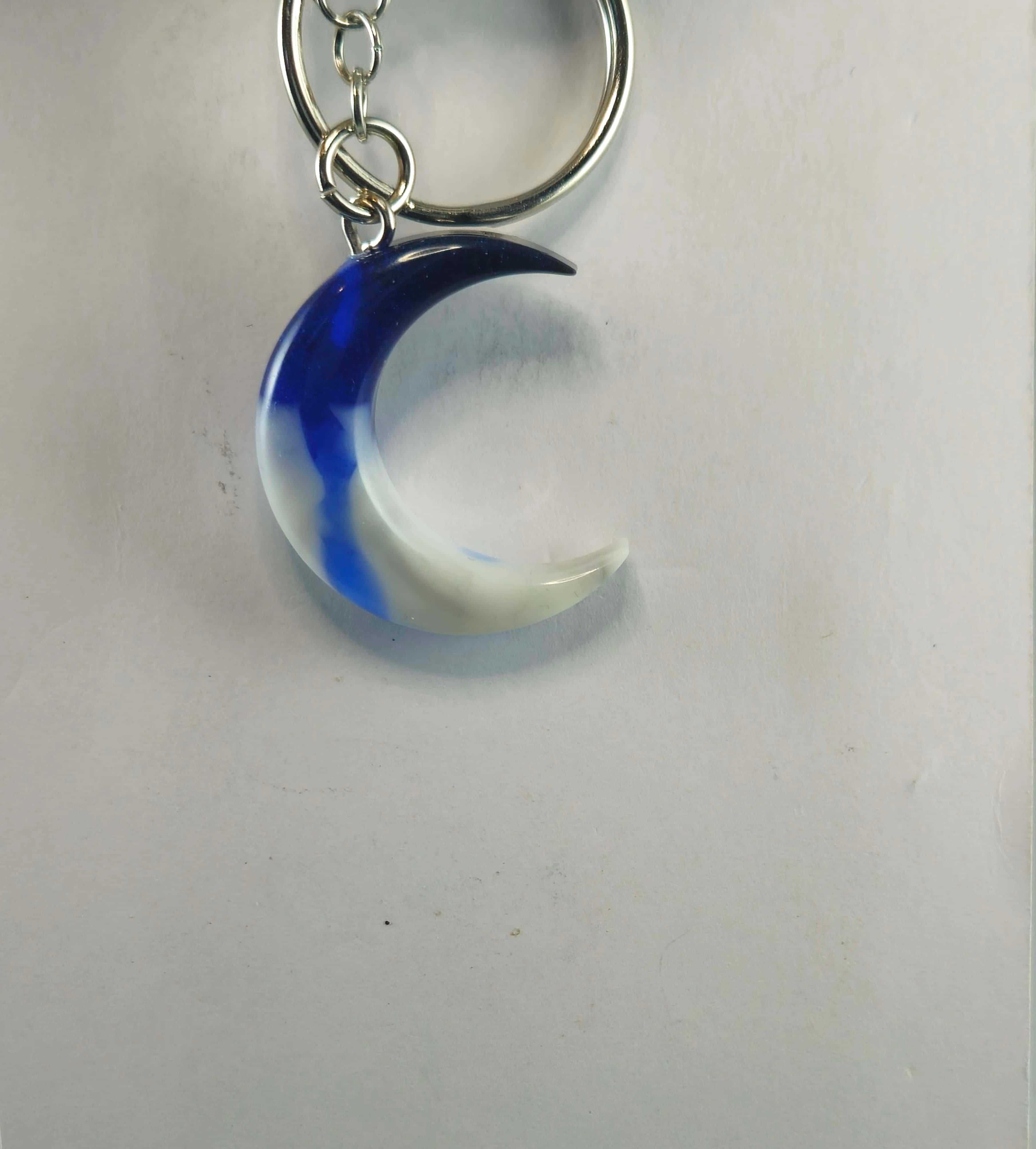 Blue and white crescent moon keychain with metallic chain