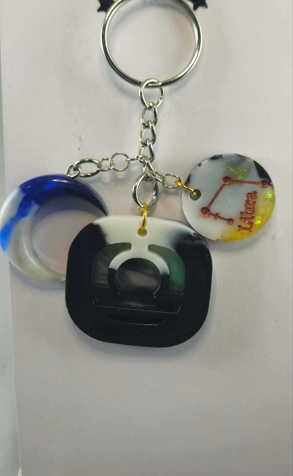 Miner's Galore Libra keychain with zodiac charm, white, onyx, and yellow accents, on a silver chain