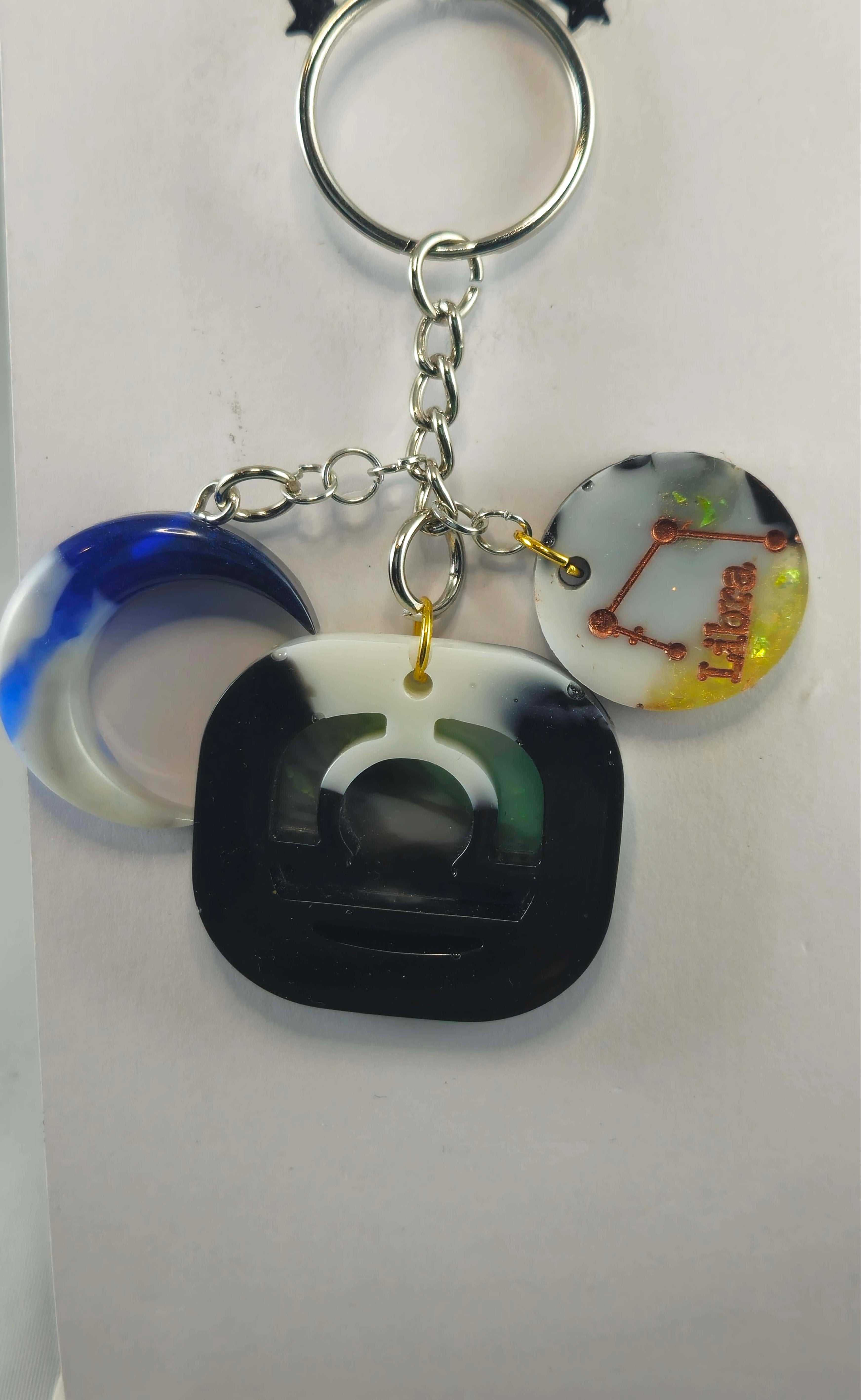 Miner's Galore Libra keychain with zodiac charm, white, onyx, and yellow accents, on a silver chain