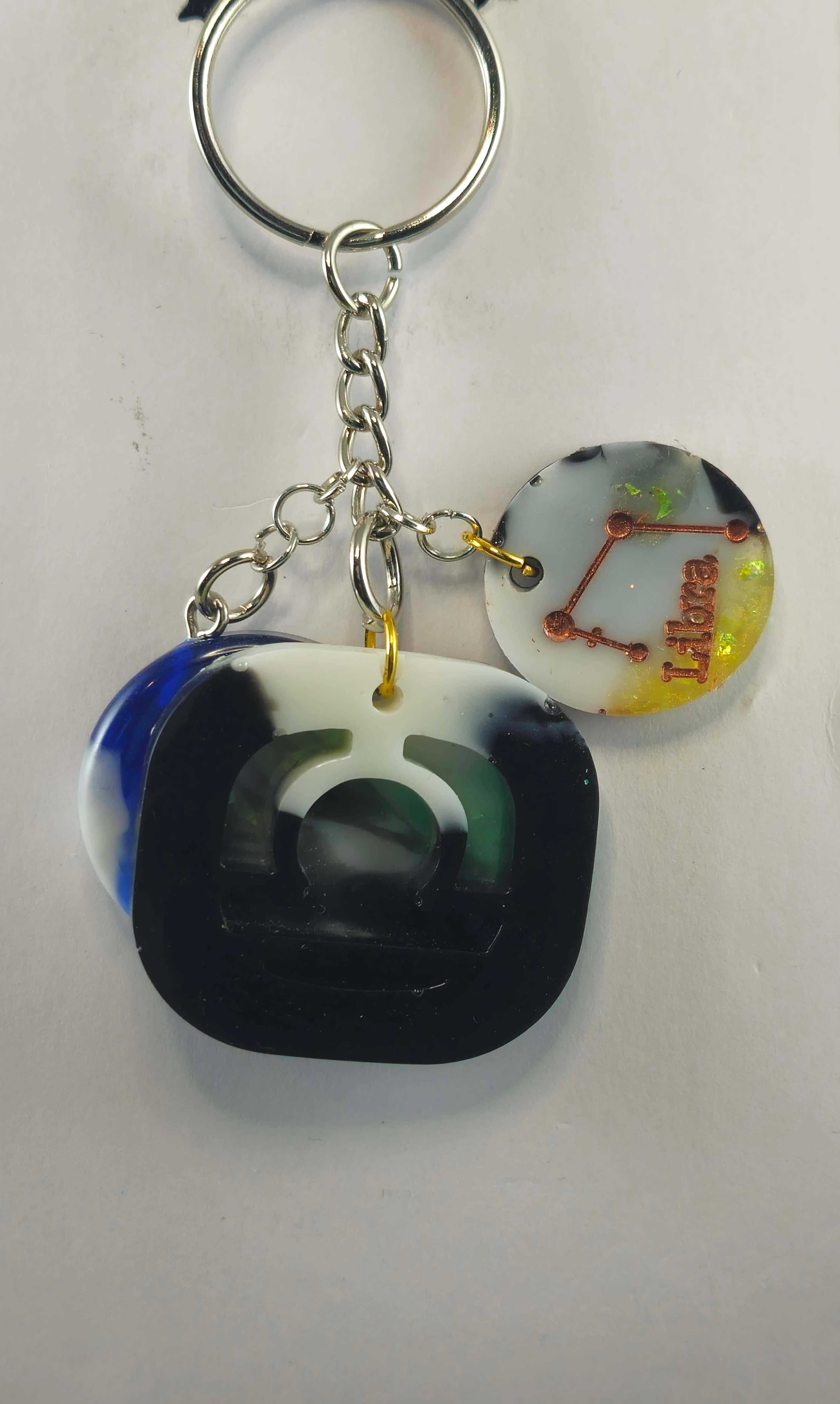 Black and white acrylic keychain with geometric design
