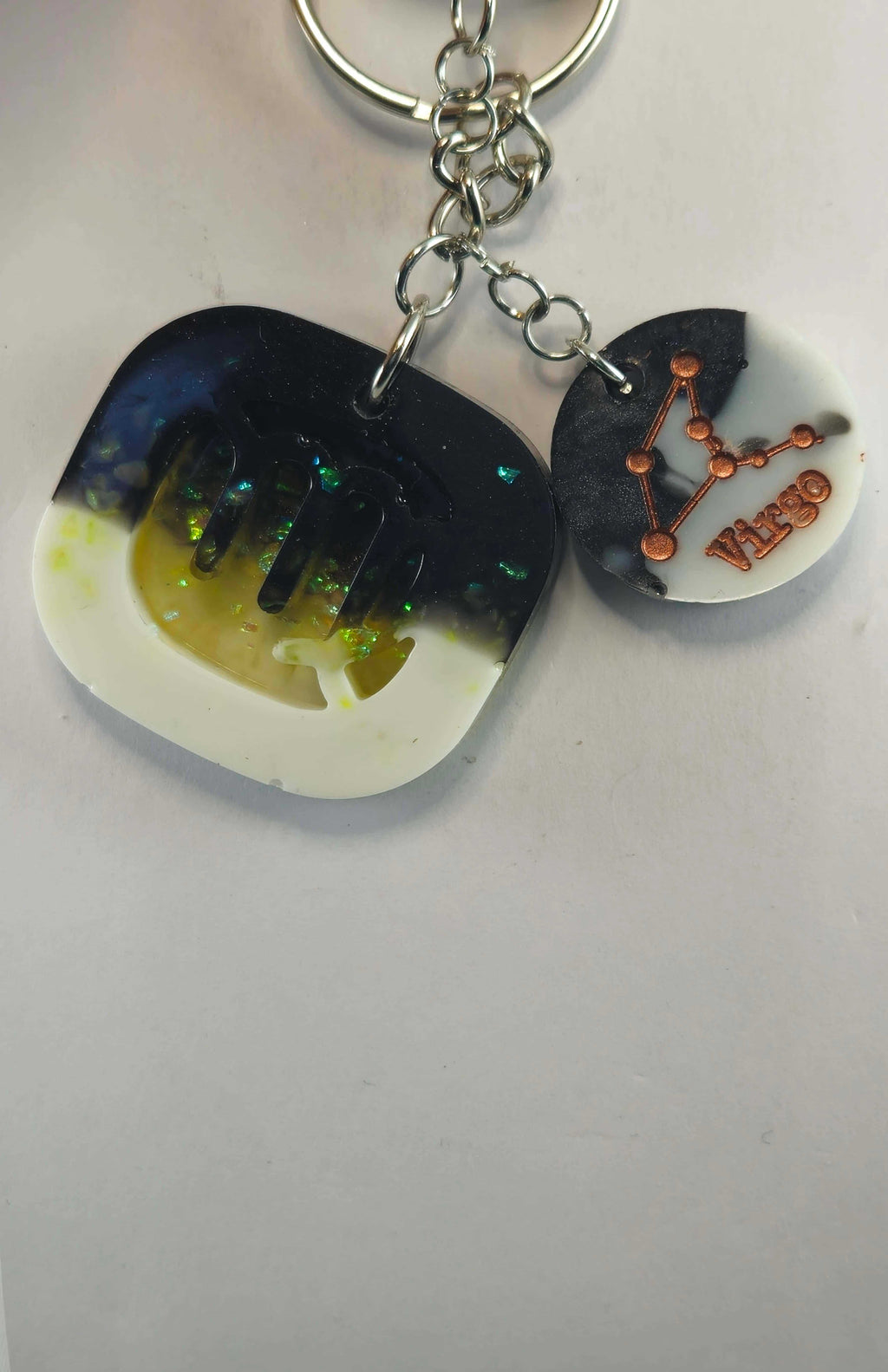 Miner's Galore Virgo zodiac keychain with black and white resin and copper constellation design