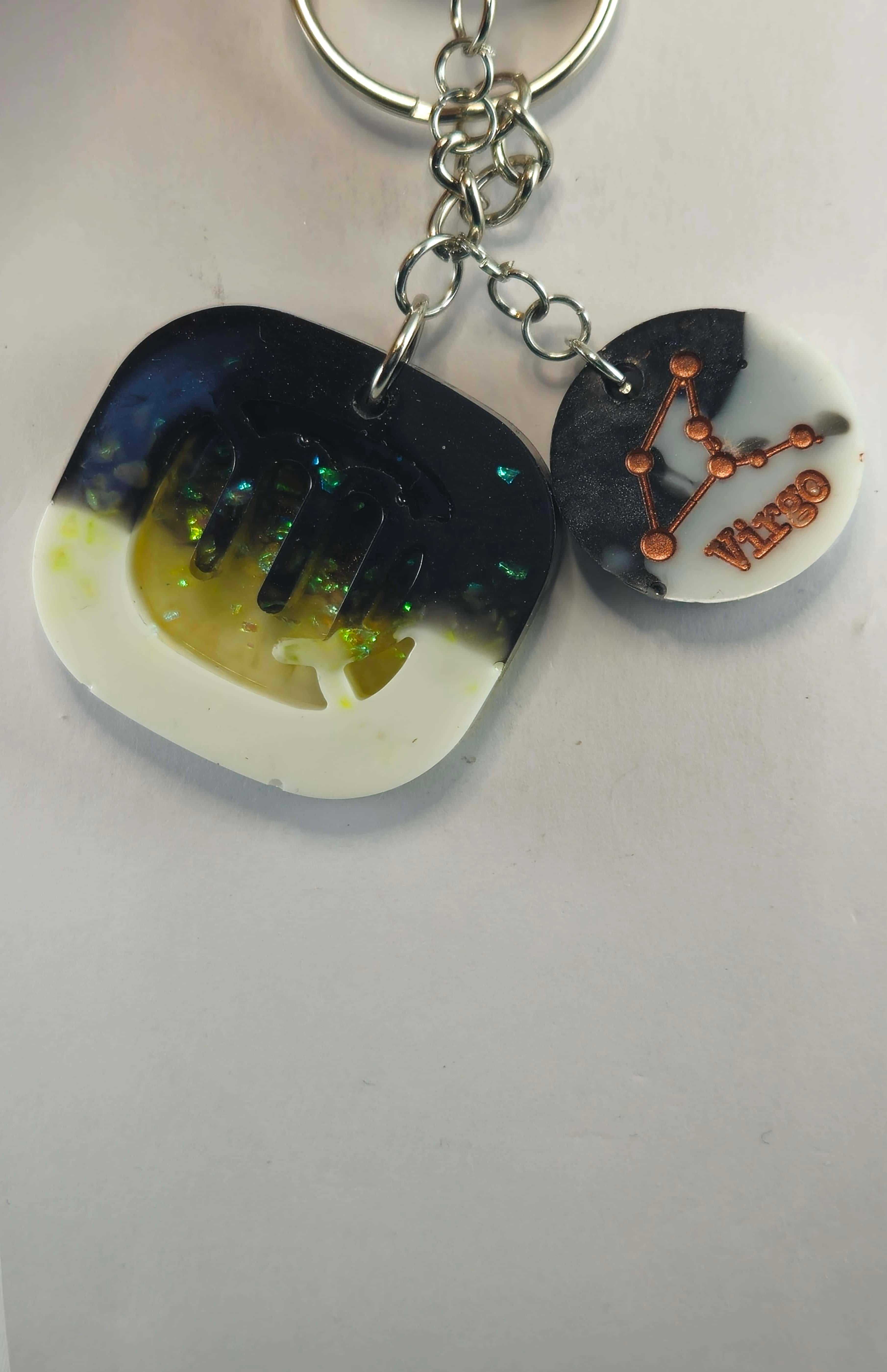 Miner's Galore Virgo zodiac keychain with black and white resin and copper constellation design