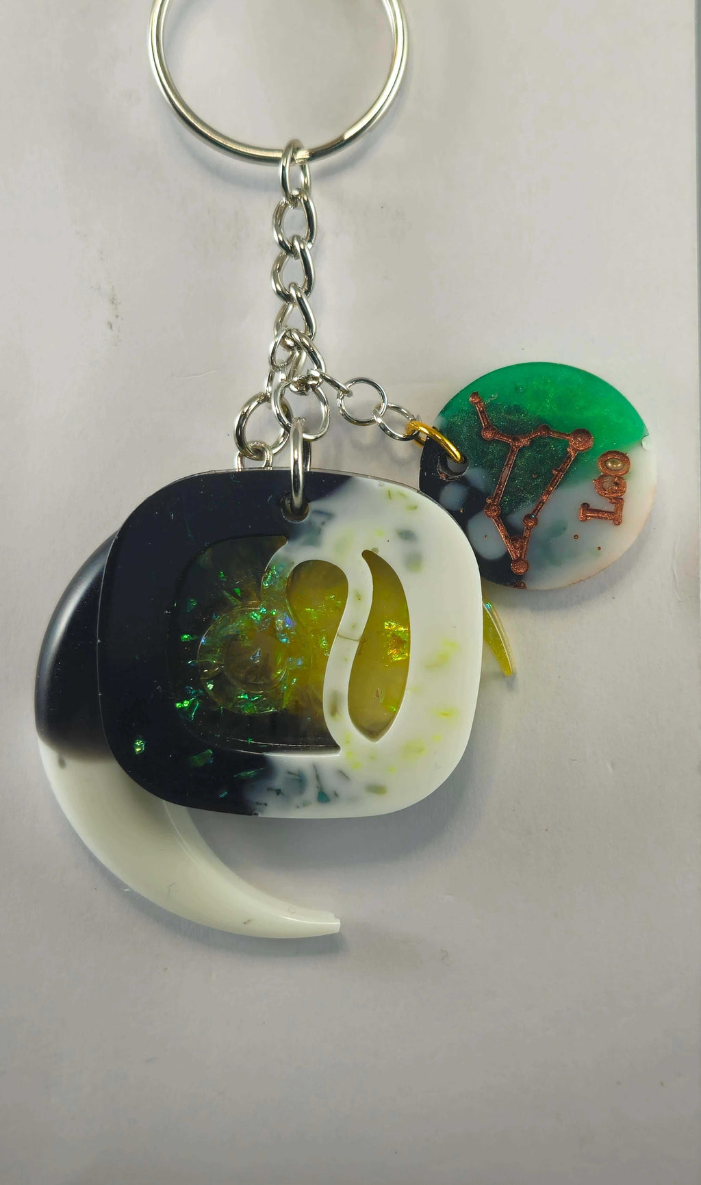 Miner's Galore Leo keychain with zodiac charm, white, onyx, and yellow accents