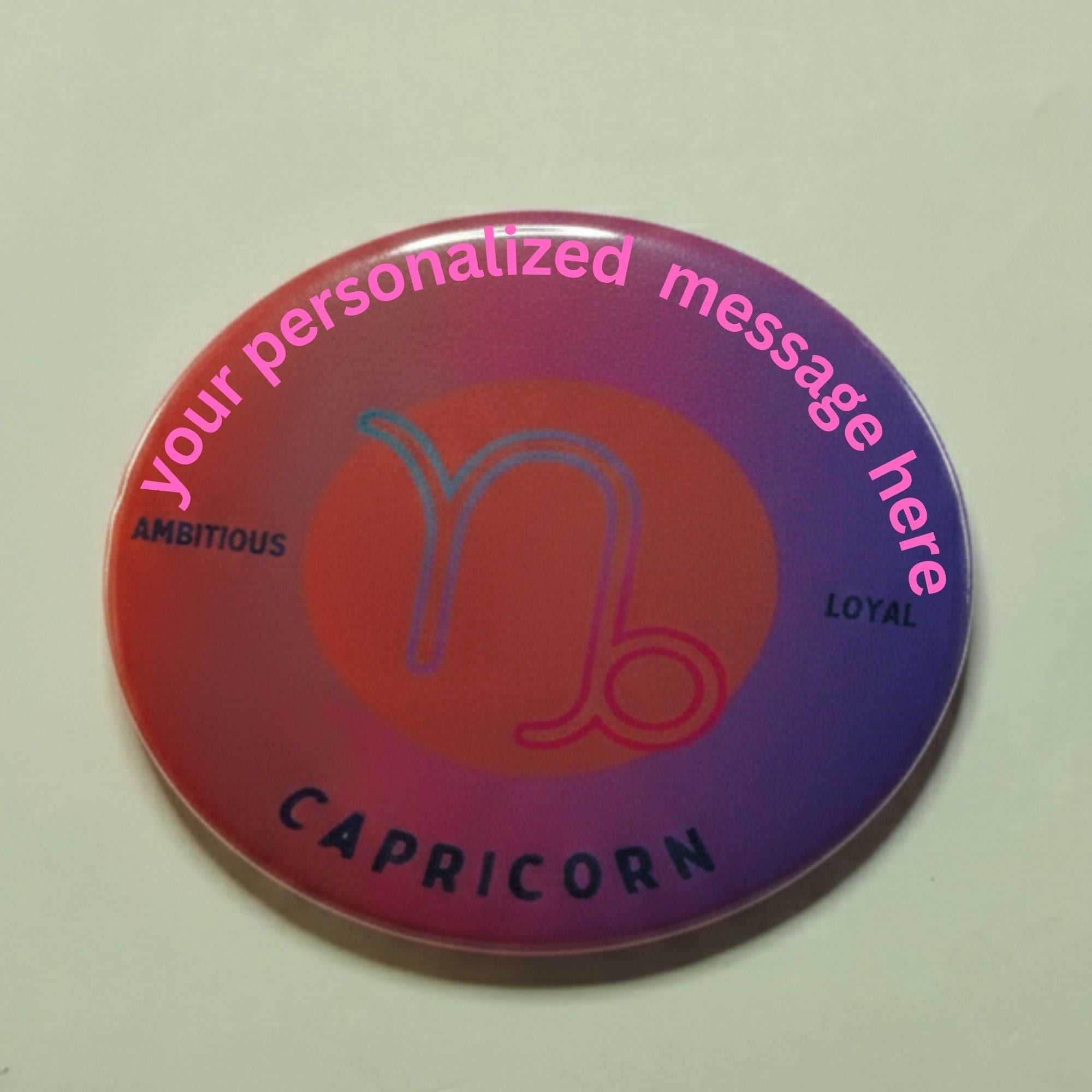 Colorful zodiac button with Aries symbol and motivational words