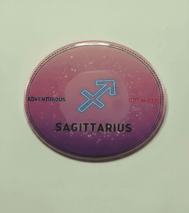 Sagittarius zodiac badge with pink purple ombre background and blue arrow symbol
