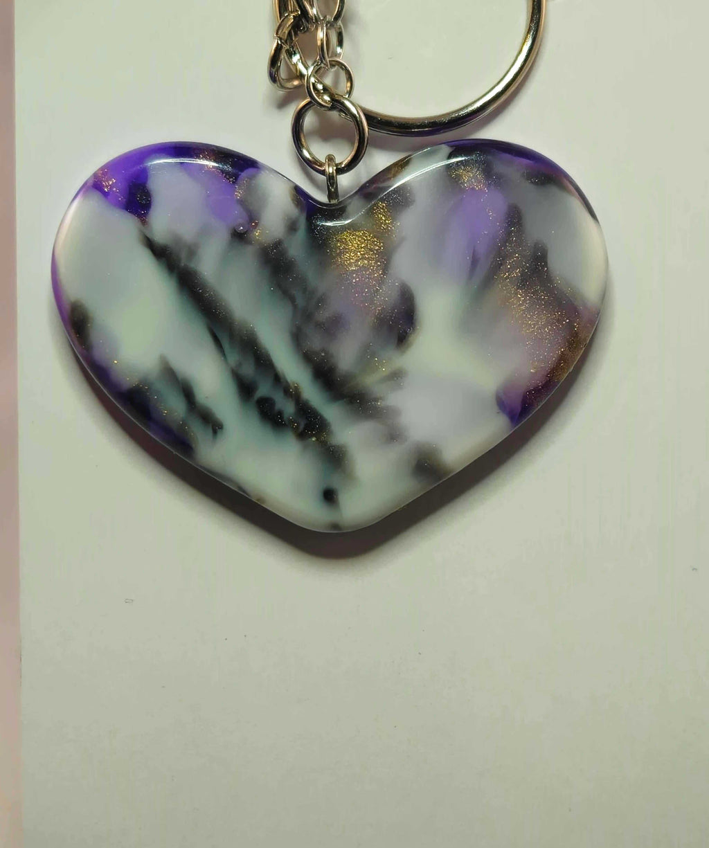 Heart-shaped Sagittarius zodiac pendant with purple and white marbled design