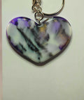 Heart-shaped Sagittarius zodiac pendant with purple and white marbled design
