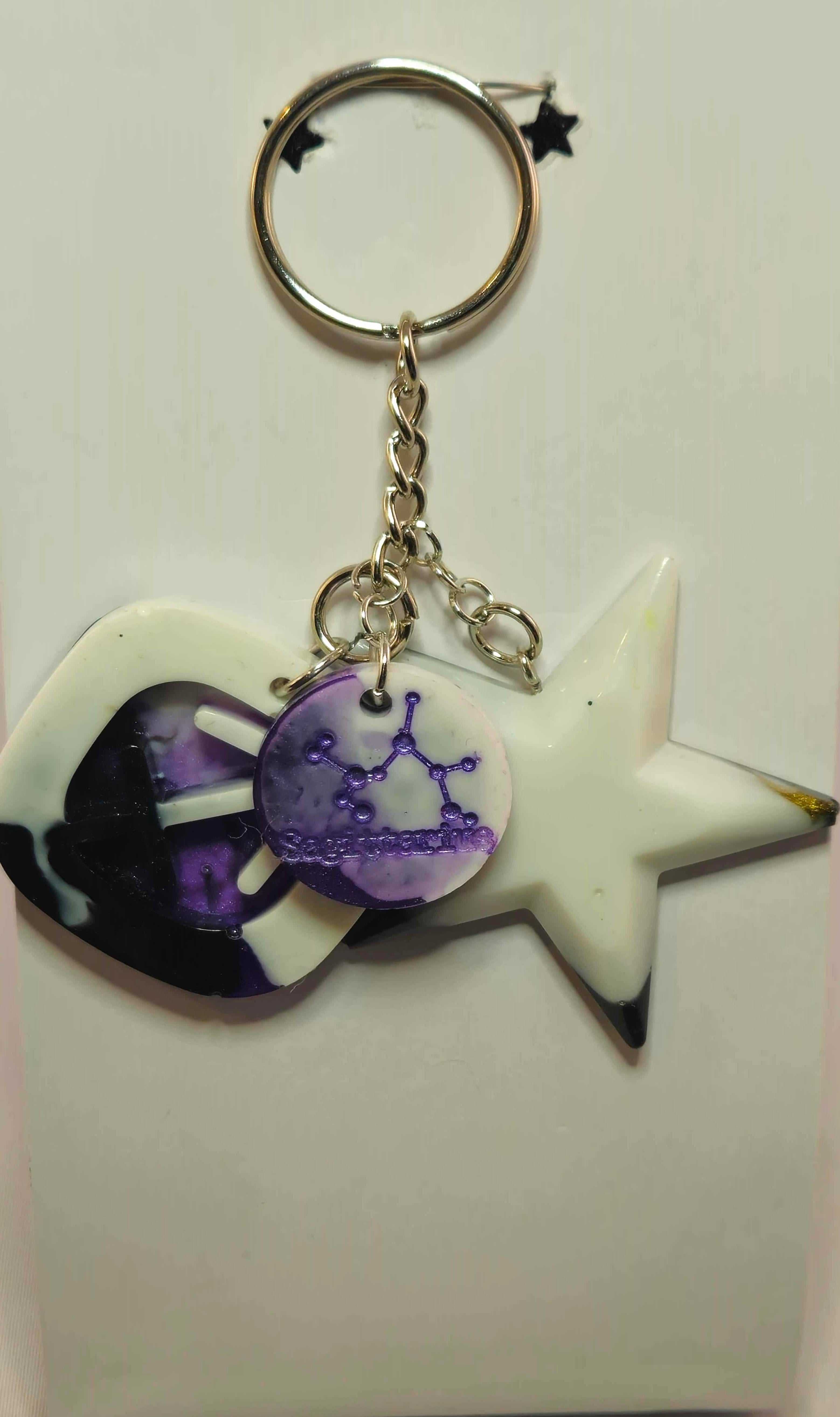 Stormy Weather Sagittarius Keychain with purple star charm and zodiac design