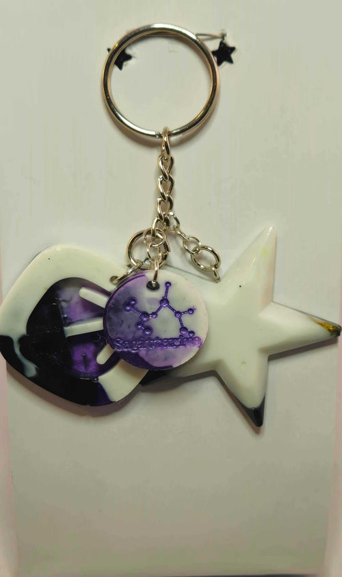 Stormy Weather Sagittarius Keychain with purple star charm and zodiac design