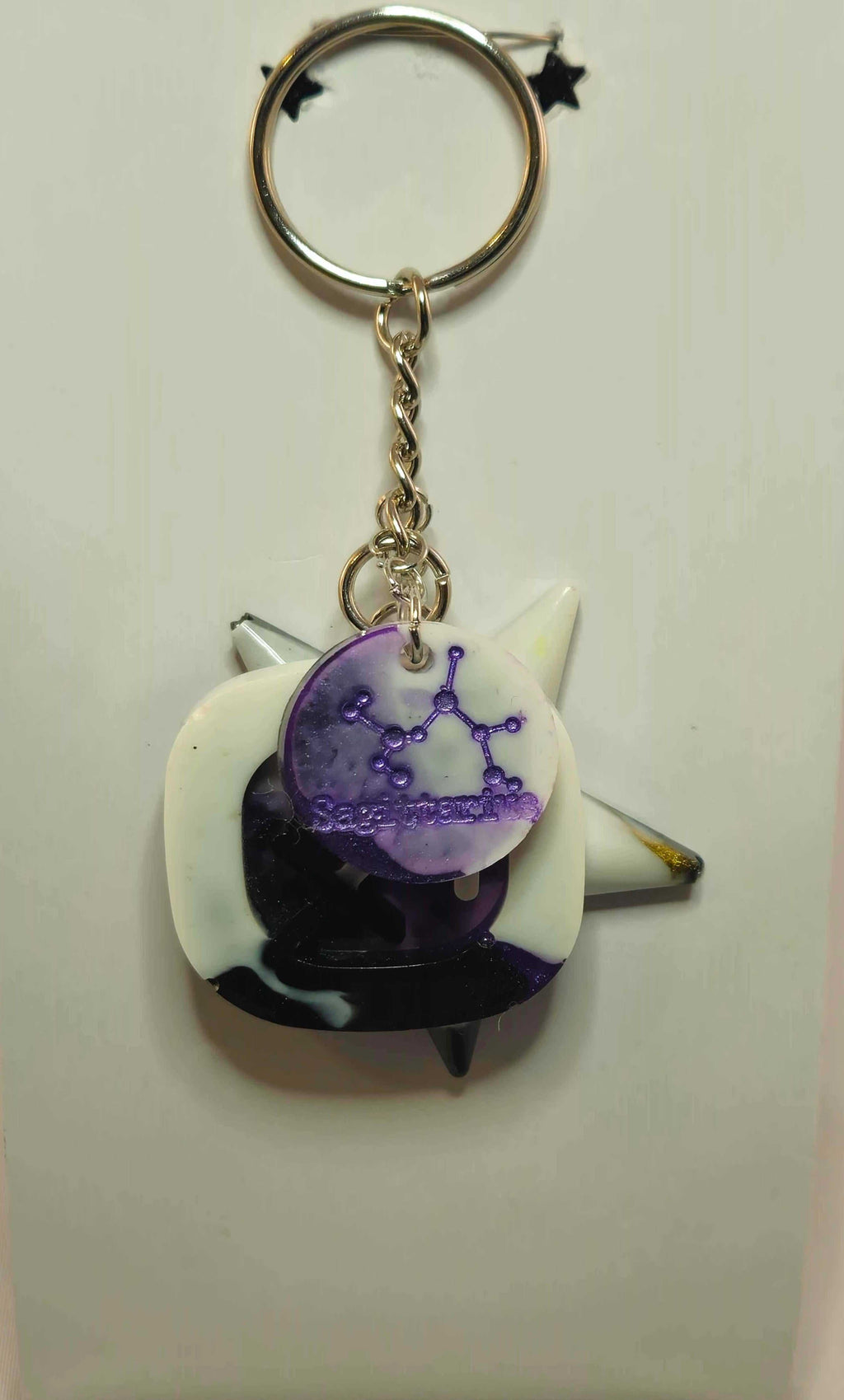 Stormy Weather Sagittarius Keychain featuring purple zodiac pendant and silver key ring
