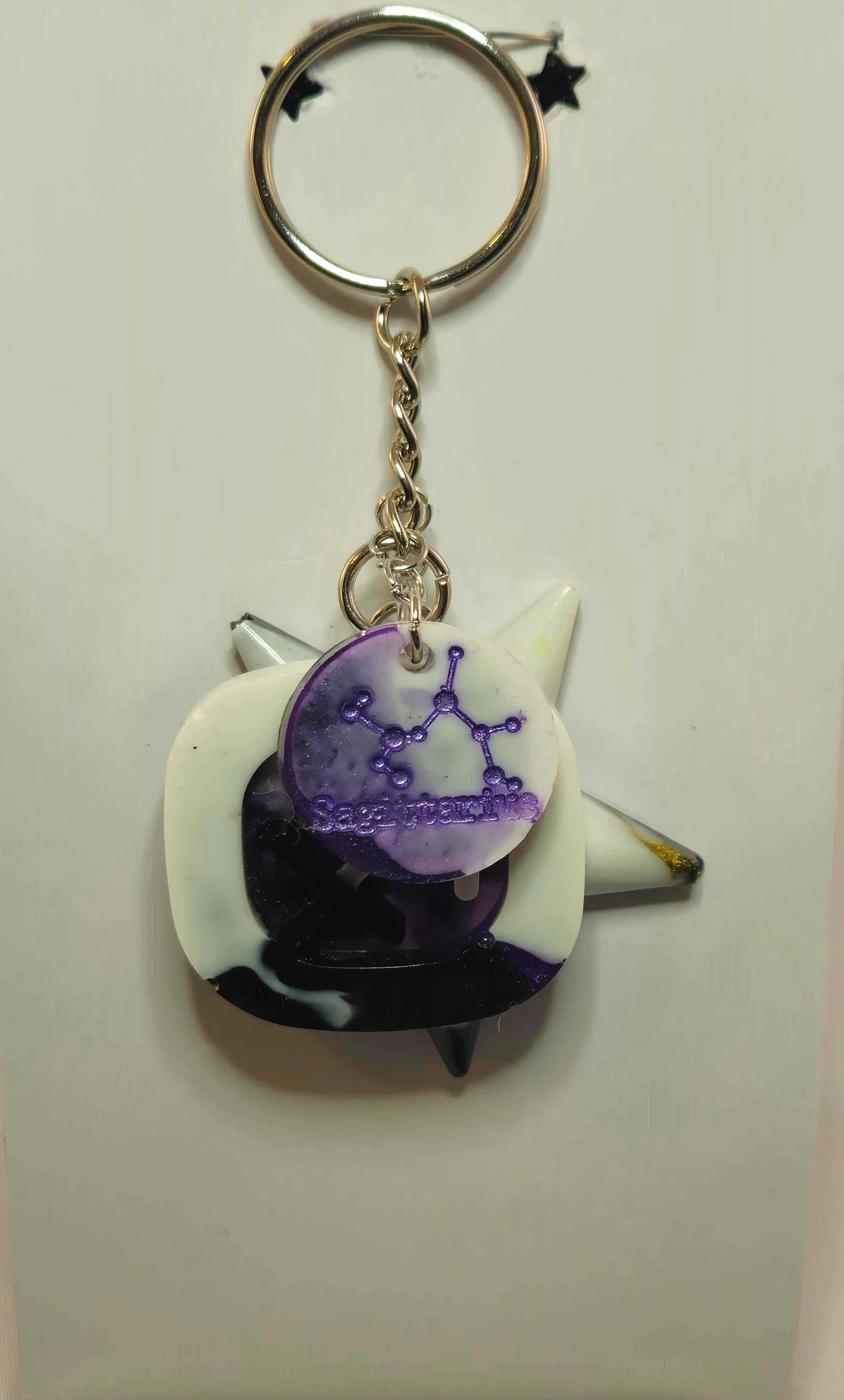 Stormy Weather Sagittarius Keychain featuring purple zodiac pendant and silver key ring
