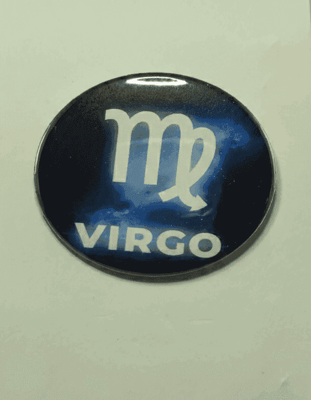 Virgo zodiac badge with celestial navy background and white Virgo symbol